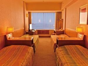 ベッドが４台入った機能的なファミリールーム