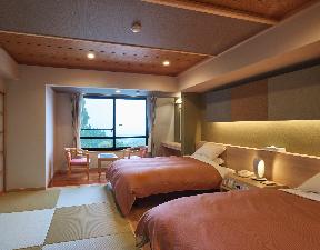 琉球畳のお部屋にツインベッド備えた和を基調とした洋室　全室 【南側向き】【空気清浄器完備】【完全禁煙室】