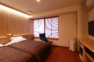 スタンダードツインのお部屋です。シモンズベッドを採用。