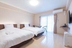 【スタンダードツイン】28平米のお部屋。お部屋の中に洗濯機・乾燥機があるので旅行の荷物を少なくできます♪洗濯洗剤は1回分50円でフロントにて販売中。