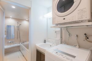 【ファミリースイート】お部屋の中に洗濯機・乾燥機有。旅行にお荷物を減らすことができます♪洗濯用洗剤は1回分50円でフロントにて販売中。