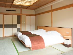 【ウイングス館】和室ツイン／畳の上にベッドを配したお部屋です（イメージ）