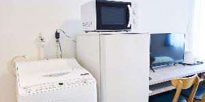 全ての客室に洗濯機と電子レンジを設置